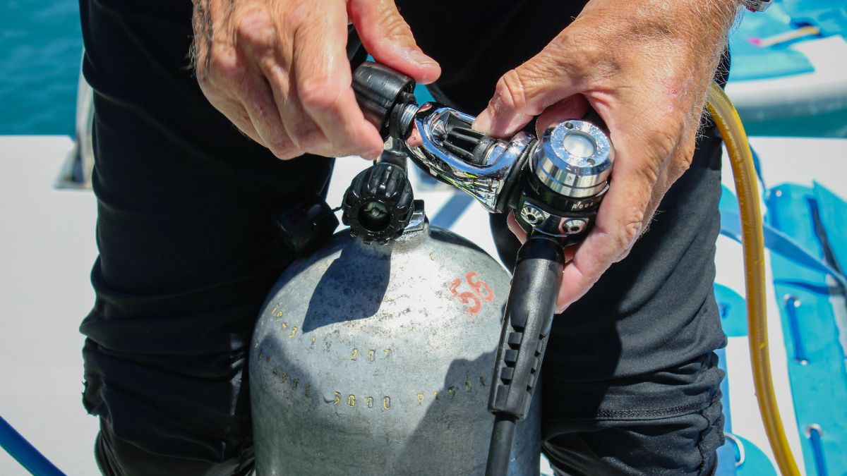 The diver secures the diving regulator after use.