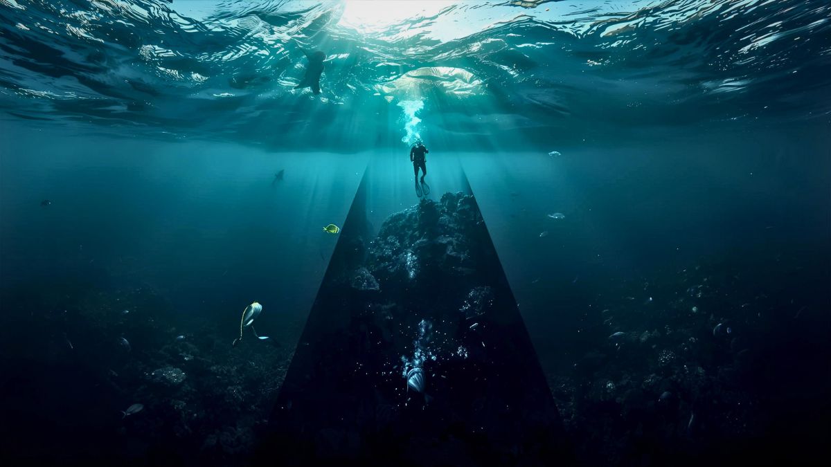 Dramatic vertical ocean cross-section showing multiple depth zones from bright surface with snorkeler through twilight zone to dark deep water illustrating ocean depth layers