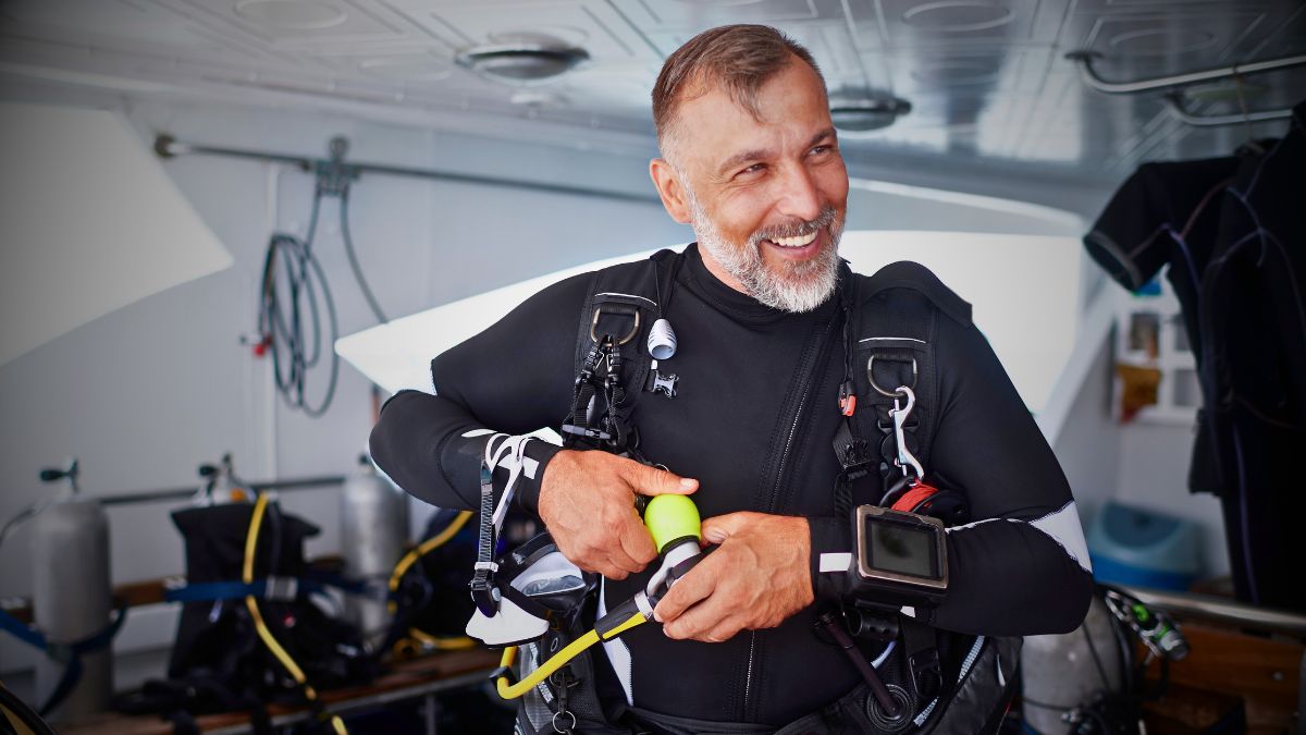 Relaxed scuba diver in peaceful meditation-like pose underwater in Costa Rica demonstrating mental and physical health benefits of diving