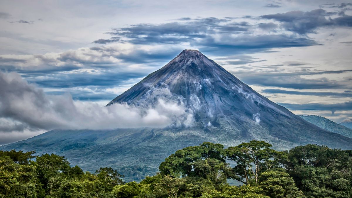 Arenal Volcano with rainforest and lake in northern Costa Rica